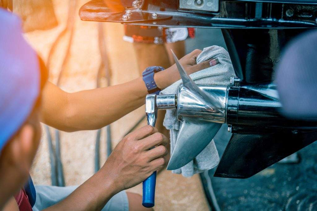 Engineer used screwdriver fixed Boat propeller in boat competiti